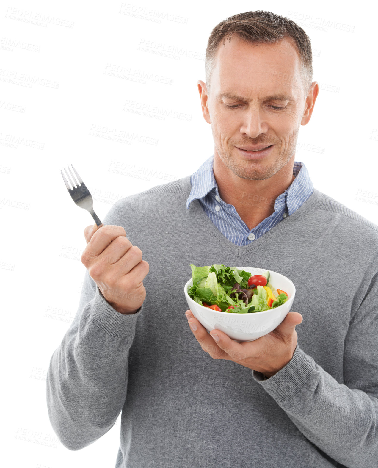 Buy stock photo Diet, nutrition and unhappy man with salad and fork disappointed with healthy lunch or dinner in studio. Health, wellness and food, model with frown and nutritional meal isolated on white background.