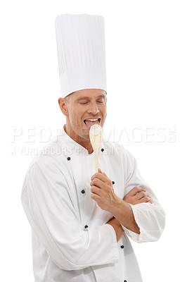 Buy stock photo Man, chef licking wooden spoon and goofy cafe owner and small business in restaurant industry isolated on white background. Happy cook, discount deal and delicious menu special or promotion in studio