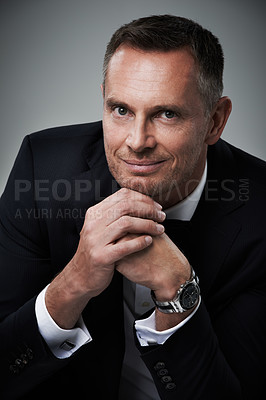 Buy stock photo Portrait, man and in suit with smile, leadership and confident guy on grey studio background. Face, male leader and entrepreneur with elegance, glamour and management with happiness or corporate deal