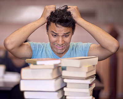 Buy stock photo Student man, stress and stack of books for education, development and pulling hair at college library. Person, learning and knowledge with anxiety, fear and mental health for assessment at university