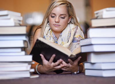 Buy stock photo Woman, library and reading book on floor for literature, learning or knowledge at bookstore. Young female person, bookworm or student looking at information for story, research or study of author