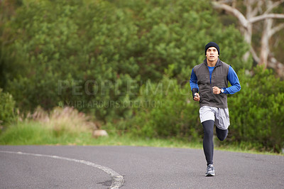 Buy stock photo Fitness, energy and a man in the street for running, training and marathon competition. Health, exercise and a male runner or athlete in the road for sports, morning cardio or a workout in nature