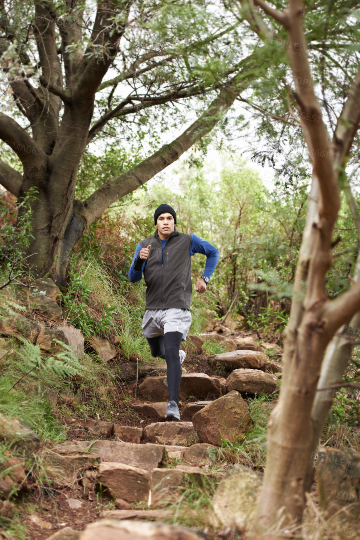 Buy stock photo A young man running outdoors