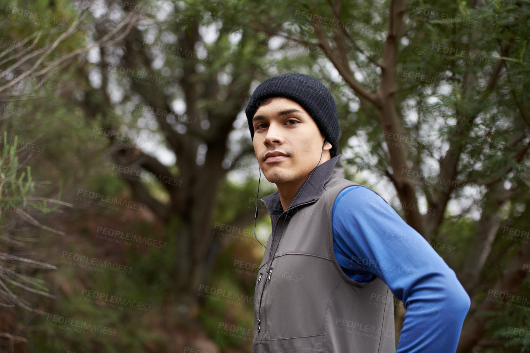 Buy stock photo Portrait, runner or man in forest ready for a workout, exercise or fitness training in park, woods or nature. Face, confident sports person or healthy male athlete with trees, wellness or energy
