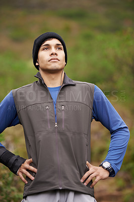 Buy stock photo Man, hiker and thinking for adventure, earphones and listening to podcast, exercise and workout. Hiking, fitness and climber for training, forest and nature to explore, hobby and health in outdoors