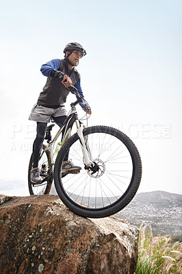 Buy stock photo Man, mountain bike and off road cycling on nature adventure or fitness in outdoor extreme sport. Male person or cyclist on bicycle for cardio or dirt path terrain on cliff for exercise with blue sky
