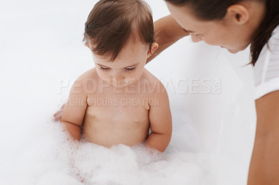 Buy stock photo Baby, mother and foam soap for washing in bathroom, bath and cleaning for skincare at home. Mommy, toddler and childcare or water for prevention of bacteria and virus, cosmetics and liquid for health