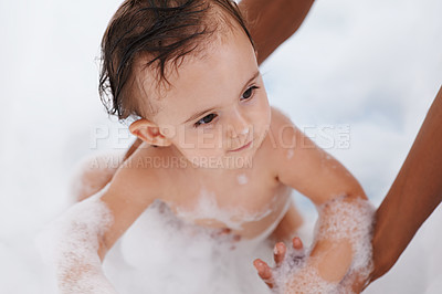 Buy stock photo Baby, hygiene and water for washing in bathroom, bath and cleaning for skincare at home. Person, toddler and childcare or healthy skin and body care for wellness, cosmetics and soap foam or liquid
