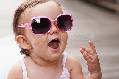 Buy stock photo Baby, laugh and sunglasses outdoor with summer, youth fashion and young girl on holiday. Kid, fun frames and happy on vacation with shades style, child clothes and trendy accessory of toddler