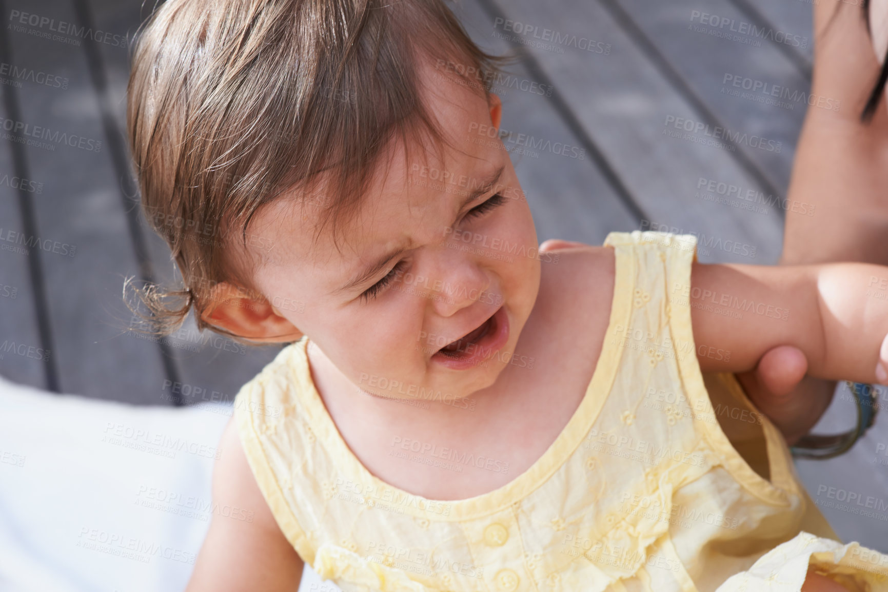 Buy stock photo Baby, girl and unhappy or crying outside on porch, sad and upset for mistake or fail in childhood. Kid, toddler and frustration and distress for info, autism and overstimulation or adhd in outdoors