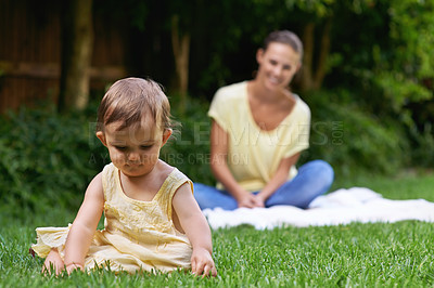 Buy stock photo Mother, baby and playing together in outdoors for bonding, love and affection or curious in childhood. Mom, toddler and happy girl or child and relaxing outside, learning and security in relationship