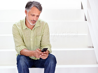 Buy stock photo Business, man or phone on stairs in office for social network, download digital app or contact in agency. Mature entrepreneur typing on smartphone, reading mobile notification or search news on steps