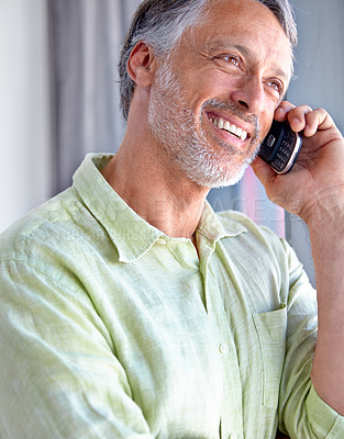 Buy stock photo Mature, smile or happy man on a phone call listening or talking for communication to relax. Confident, retirement or male senior person in home calling to chat in conversation or speaking on mobile