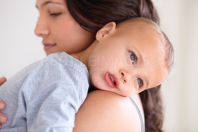 Buy stock photo Mom holding baby boy in home for sleep, bonding and child care with support in morning. Woman, tired toddler and nap time together in bedroom with development, trust and safety with mothers love.
