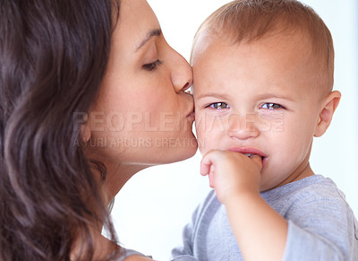 Buy stock photo Cropped shot of a beautiful young woman and her baby at home