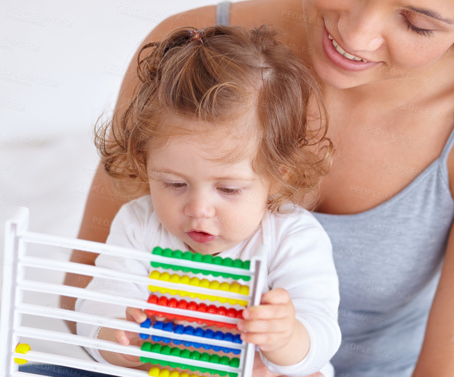 Buy stock photo Abacus, math and toddler with mother playing, learning and teaching for child development on bed. Bonding, toy and closeup of mom teaching kid, infant or baby with counting in bedroom at home.