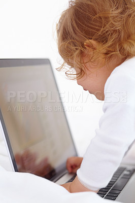 Buy stock photo Baby, learning and playing with laptop in home and cartoon, movies or games for education. Infant, kid and typing on computer in bedroom for child development, growth and website for elearning