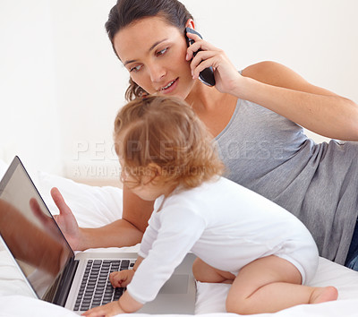 Buy stock photo Working, phone call and mom with baby on laptop multitasking in home. Infant, kid and mother busy with computer and smartphone for remote work, productivity and online communication in bedroom
