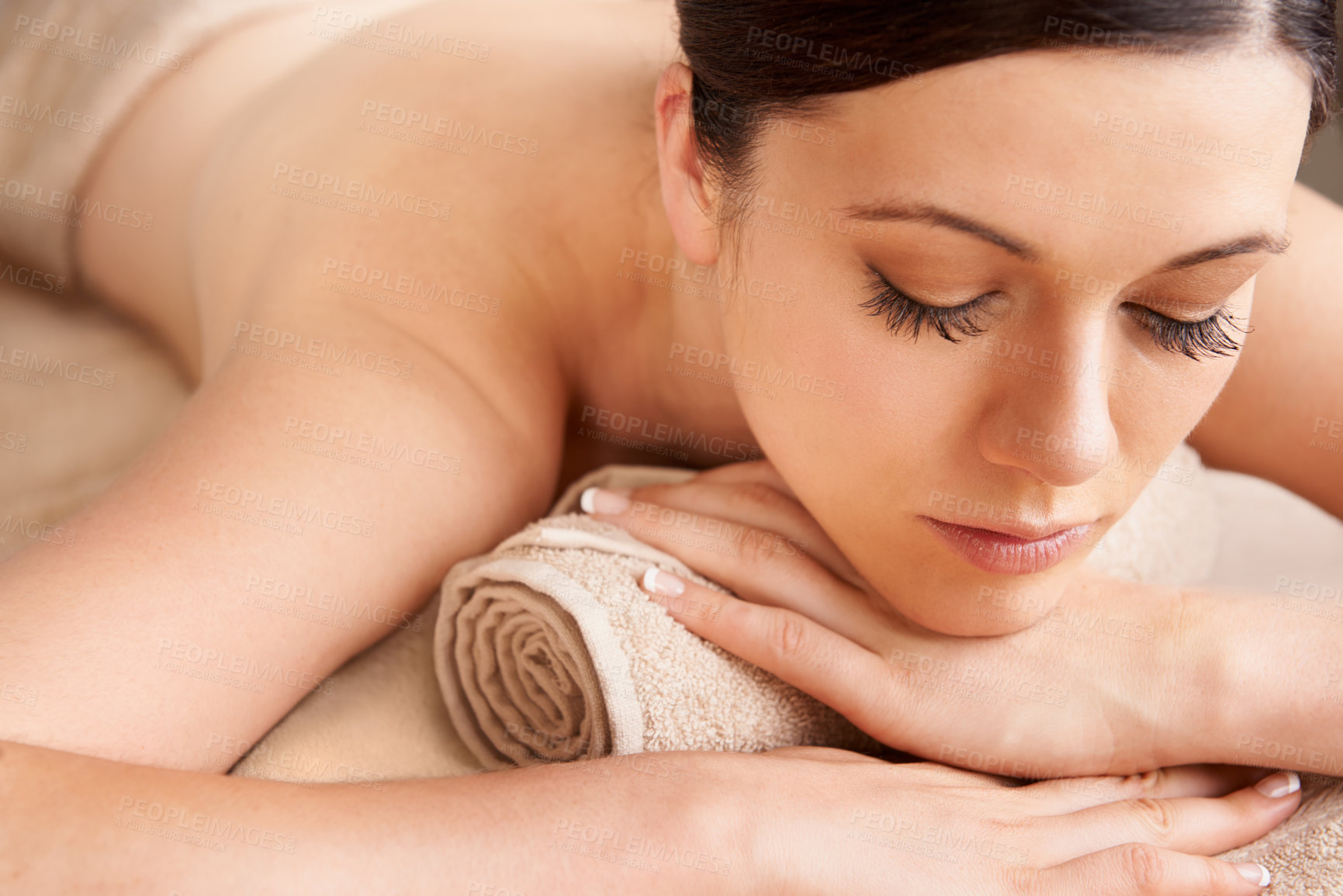 Buy stock photo Spa, woman and relax for massage, wellness and luxury for health, calm and lying on table. Skincare, female and girl bare for body treatment and natural beauty for detox, peaceful or holiday