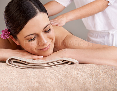 Buy stock photo Spa, luxury and woman relax, happy and enjoy massage for holiday, peaceful and skincare. Zen, young female and lady enjoy healthy, break and bare with smile, calm or vacation for wellness and beauty.