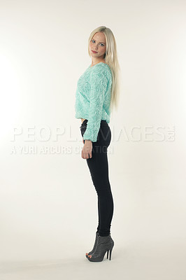 Buy stock photo A young model in trendy clothing posing against a white background