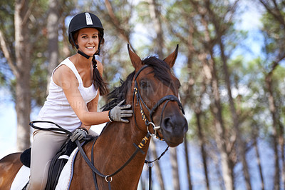 Buy stock photo An attractive young woman on horseback 
