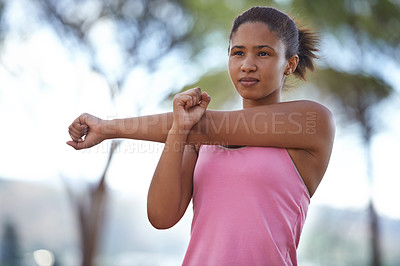 Buy stock photo A young teenager warming up for the run ahead