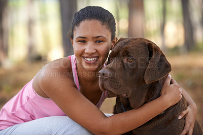 Buy stock photo A young ethnic woman saitting outside with her dog