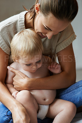 Buy stock photo Holding, baby and mom in home with love, comfort and bonding in morning. Infant, kid and mother relax together in embrace with care for wellness, development and growth of relationship in bedroom