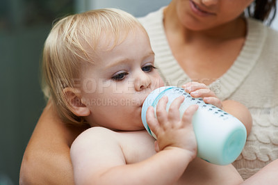 Buy stock photo Relax, cute and baby drinking bottle and laying with mother with milk for bonding together. Growth, sweet and infant, kid or toddler enjoying a beverage for nutrition, health and child development.
