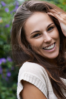 Buy stock photo Portrait of an attractive young woman standing in the garden