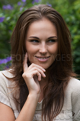 Buy stock photo An attractive young woman standing in the garden