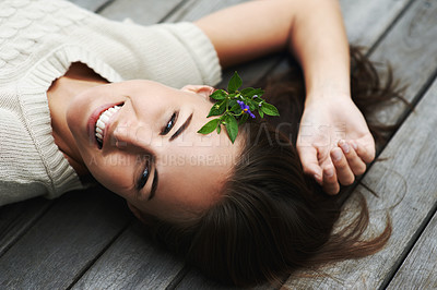 Buy stock photo Woman lying on her porch, relax and summer with smile, happiness and chilling on a weekend break. Person, outdoor and girl with joy, cheerful and plant in her hair, holiday and floral with vacation