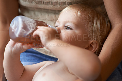 Buy stock photo Relax, bonding and baby drinking bottle and laying with mother for nap time with refreshing tea. Cute, sweet and infant, kid or toddler enjoying a beverage for nutrition, health and child development