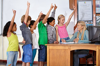 Buy stock photo Teacher woman, classroom and children with raised hand for question, answer or pop quiz for knowledge. Teaching person, school kids and education for development, scholarship or assessment at academy