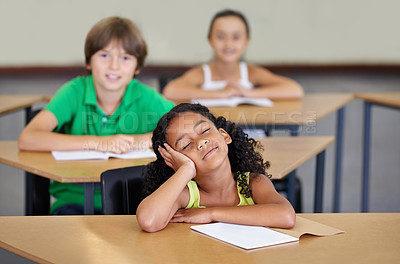 Buy stock photo Sleepy, children and bored of learning, education or books from adhd, burnout or frustrated with mindset in school. Exhausted, girl or thinking of studying, group or problem with fatigue in classroom
