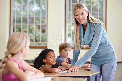 Buy stock photo Portrait, woman and happy teacher in class helping students in classroom. Teaching, female educator and smile of person with children learning in primary school for education, studying or knowledge.