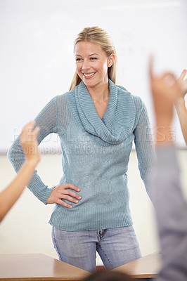 Buy stock photo Hands in the air, woman and teacher with students, education and knowledge in a classroom. School, educator and kids with questions, answer and child development with a smile, learning and happiness