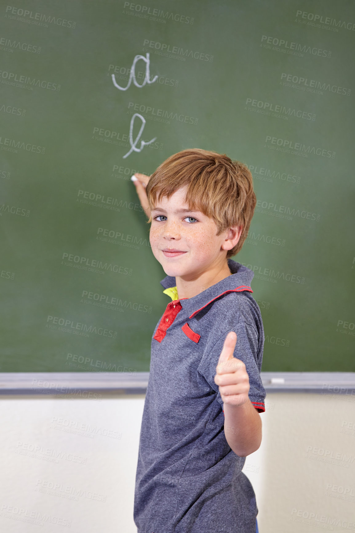 Buy stock photo Portrait, child and student with thumbs up on blackboard in classroom, elementary school and mockup. Chalkboard, education and kid with hand gesture for like emoji, agreement and learning to write.