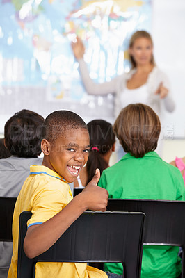 Buy stock photo Black child, portrait and thumbs up of student in class, elementary school or classroom. Funny, education and kid with hand gesture for like emoji, agreement or learning, success and approval sign.