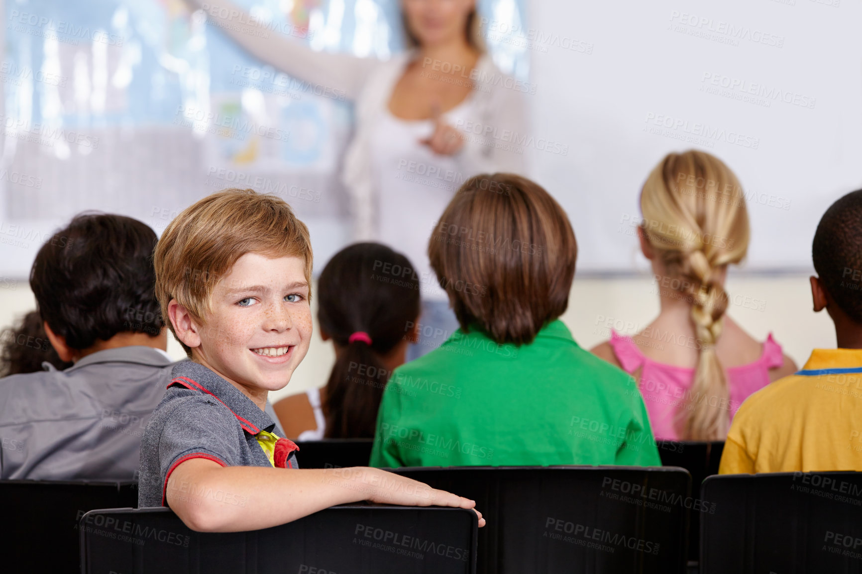 Buy stock photo Portrait, happy boy or student in classroom for knowledge, education or development for future growth. Smile, back to school or child in chair for studying, listening or fun learning for scholarship