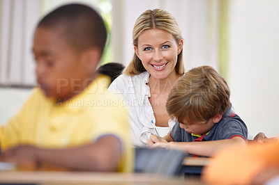 Buy stock photo Portrait of teacher, kid or writing in classroom for learning, education and helping for development. Happy woman teaching, boy or child student with knowledge, support or notebook at middle school