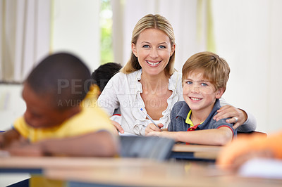 Buy stock photo Portrait of happy teacher, child or writing in classroom for learning, education and helping for development. Woman teaching, hug or boy student with knowledge, support or notebook at middle school