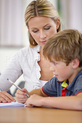 Buy stock photo Teacher, student and help with school work in classroom, question and think of answer for education and knowledge. Teaching, learning and woman with boy in class, study and problem solving for test