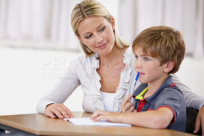 Buy stock photo Teacher, student and help with school work in class, question and think of answer for education and knowledge. Teaching, learning and woman with boy in classroom, study and problem solving for test