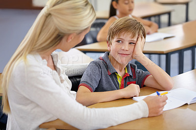 Buy stock photo Teacher woman, boy and school to check notebook, support and knowledge for education with motivation. People, learning and development with writing, child and feedback for progress, desk or academy