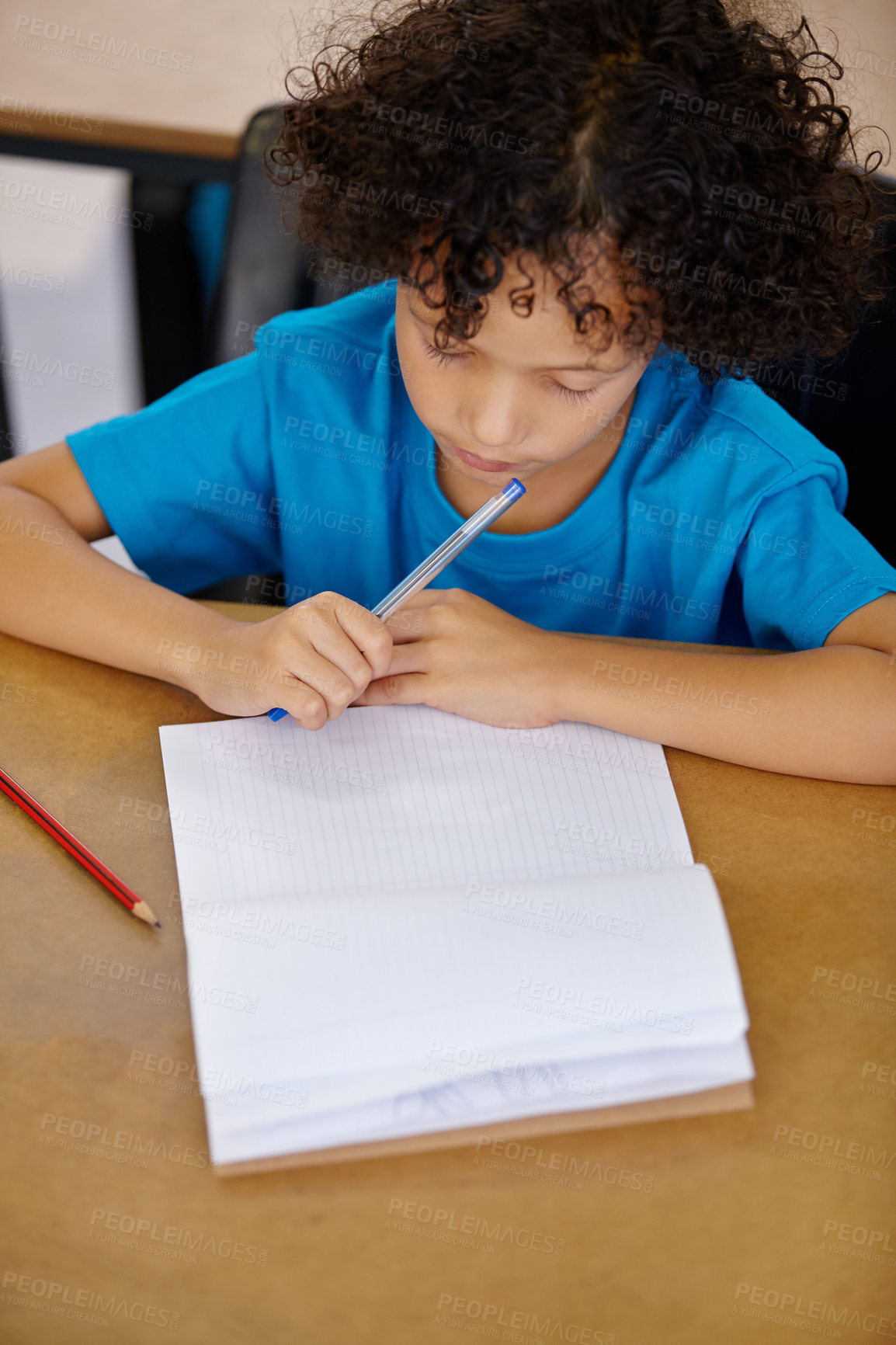 Buy stock photo Student, thinking and child writing in notebook above desk with pencil, paper and learning in school. Kid, education and start of study on table in class with question or curiosity from lesson