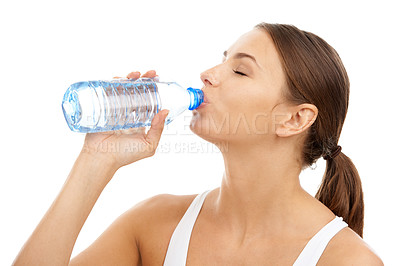 Buy stock photo Exercise, woman and drinking water in studio for sports break, energy and detox for healthy recovery on white background. Athlete, hydration and bottle of liquid for nutrition, fitness diet or thirst