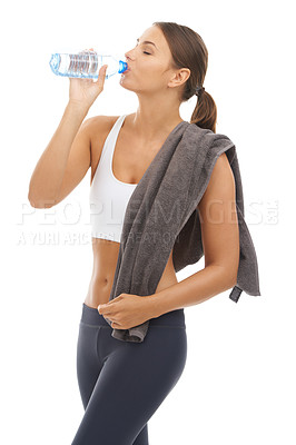 Buy stock photo Woman, towel and drinking water in studio for exercise recovery, energy and healthy detox on white background. Thirsty model, fitness and bottle for sports nutrition, weight loss diet and hydration