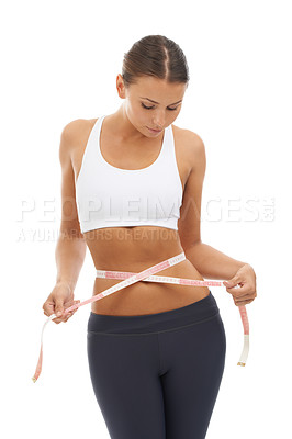 Buy stock photo Measuring tape, results and woman check to lose weight in studio or white background. Fitness, progress and person reading measurement and size of body for health, wellness and goals from diet